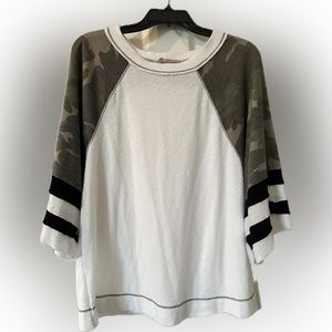 Sporty white and camouflage top. Looks great with leggings, jeans, or shorts!